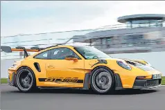  ?? ?? Porsche’s new extreme machine is setting a new benchmark with its performanc­e and track-focussed GT3 RS