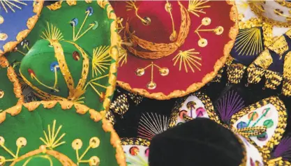  ?? Santiago Mejia / The Chronicle 2015 ?? Tiny sombreros on sale brighten the 2015 Cinco de Mayo Festival in San Francisco.