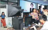  ?? CHEN SHICHUAN / FOR CHINA DAILY ?? A resident has her photo taken as she applies for a passport at an entry and exit office in Chongqing’s Yongchuan district in July.