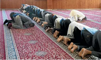  ?? ROSA WOODS/STUFF ?? Members of the Wellington Islamic community praying yesterday.