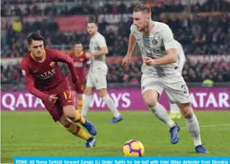  ??  ?? ROME: AS Roma Turkish forward Cengiz (L) Under fights for the ball with Inter Milan defender from Slovakia Milan Skriniar during the Italian Serie A football match at the Olympic stadium in Rome on Sunday. — AFP