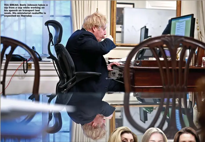  ??  ?? TEA BREAK: Boris Johnson takes a sip from a cup while working on his speech on transport last week. His ministeria­l reshuffle is expected on Thursday