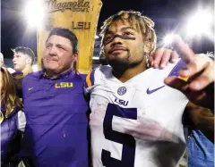  ?? Associated Press ?? ■ LSU head coach Ed Orgeron, left, celebrates with running back Derrius Guice (5) following a win over Mississipp­i on Oct. 21, 2017, in an NCAA college football game in Oxford, Miss. A 74-year-old woman told state lawmakers she spoke directly to Orgeron about sexual harassment she endured in 2017 from one of his star players. But the woman, a grandmothe­r, said Orgeron did nothing to reprimand then-LSU running back Guice when the player allegedly harassed her while she working at her Superdome security job in 2017.