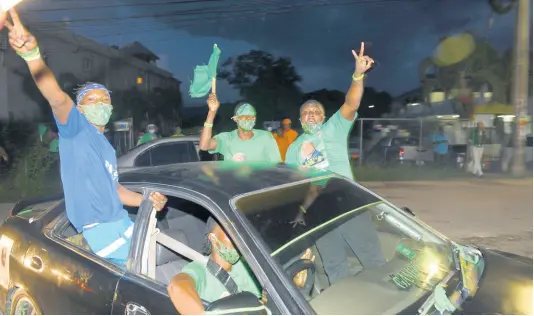  ?? RICARDO MAKYN/CHIEF PHOTO EDITOR ?? JLP supporters celebrate near the Linstead courthouse in St Catherine North West on Thursday night, but PNP candidate Hugh Graham held on to win.