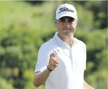  ?? — GETTY IMAGES ?? Justin Thomas shot his third straight round of 67 Saturday at Kapalua Golf Club in Lahaina, Hawaii, to hold a two-stroke lead going into the final day.