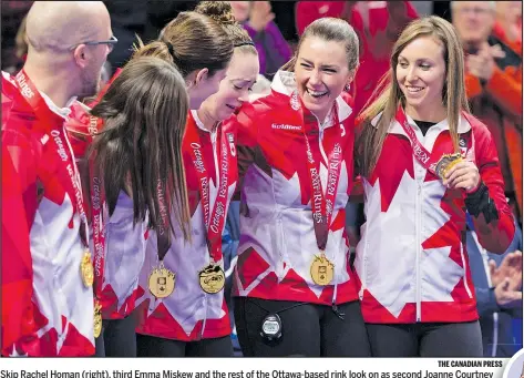  ?? THE CANADIAN PRESS ?? Skip Rachel Homan (right), third Emma Miskew and the rest of the Ottawa-based rink look on as second Joanne Courtney cries during the national anthem after it won the Canadian women’s Olympic trials yesterday, beating Chelsea Carey 6-5.