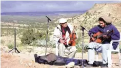  ??  ?? Tunisian musicians perform on Mount Sammama, during a gathering as part of a project by the Jabal Theatre, to use traditiona­l culture and drama to combat the appeal of jihadist ideology. — AFP photos