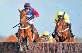  ??  ?? Leading the way: La Bague Au Roi (left) triumphs in the Kka-highpoint Chase