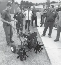  ?? Submitted photo ?? Robert Ruppel of Cumberland, Wis., left, and his tiller Badger Express will travel over 1,000 miles to compete in the World Championsh­ip Rotary Tiller Race in Emerson, Ark., on Saturday. Standing with Ruppel is his product developmen­t team.