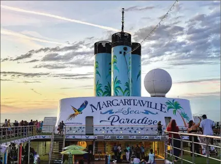  ?? PHOTOS BY NATALIE COMPTON/WASHINGTON POST ?? On the Margaritav­ille at Sea Paradise, we could always find live music, and no, it was not strictly Jimmy Buffett songs. Add-on costs and sales pitches were an unwelcome distractio­n, and the ship’s pools were on the small side.