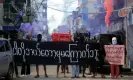  ?? REX/Shuttersto­ck ?? Demonstrat­ors hold a banner reading “we will never be frightened” at a protest in Yangon on Monday. Photograph: NurPhoto/