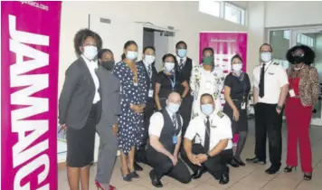  ??  ?? Crew members of Copa Airlines are flanked by local tourism partners upon their arrival at the Sangster Internatio­nal Airport (SIA), when the airline resumed flights between Panana City in Panama and Montego Bay.