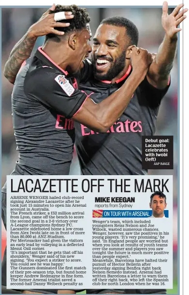  ?? AAP IMAGE ?? Debut goal: Lacazette celebrates with Iwobi (left)