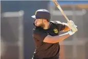  ?? K.C. ALFRED U-T ?? The Padres’ Eric Hosmer, batting at spring training Wednesday, hit .287 with an .855 OPS in 2020.