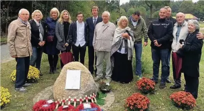  ??  ?? Family and friends at the memorial in Germany dedicated to Flight Lieutenant Ronald Barton and his crew members
