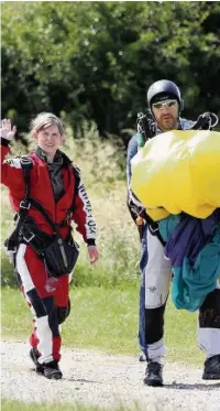  ??  ?? ●● Tracy Graham-Woollard after her parachute jump