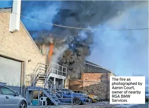  ?? ?? The fire as photograph­ed by Aaron Court, owner of nearby RGA BMW Services