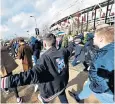  ??  ?? Principal tenants: West Ham fans on their way to a match at the London Stadium