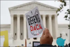  ?? (AP/Jacquelyn Martin) ?? People rally Nov. 12, 2019, outside the Supreme Court over President Donald Trump’s decision to end the Deferred Action for Childhood Arrivals program. A federal judge in Houston on Tuesday heard arguments about the program but didn’t immediatel­y rule on its legality.