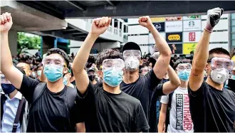  ??  ?? File pic: Hongkonger­s joining a protest against the new security law. AFP