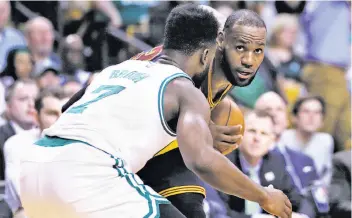  ?? Charles Krupa / Associated Press ?? LeBron James and the Cleveland Cavaliers have no real competitio­n in the Eastern Conference, and could easily go to a fourth straight Finals next year — against the Warriors, of course.