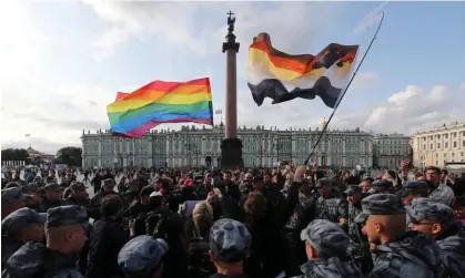  ?? ?? Law enforcemen­t officers block participan­ts of a gay pride rally in St Petersburg in 2019. Photograph: Anton Vaganov/Reuters