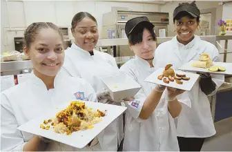  ?? STAFF PHOTOS BY ANGELA ROWLINGS ?? EATING SMART: Boston Day and Evening Academy students Perla Peguero, left, Shatoria Smith, Jasline Gonzalez and Raven Guerra show off their culinary creations yesterday ahead of tomorrow’s Cooking up Change competitio­n.