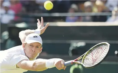  ?? Picture: AFP ?? SA’S PRIDE. Kevin Anderson returns against Roger Federer during their men’s singles quarterfin­als match on the ninth day of the 2018 Wimbledon Championsh­ips yesterday.