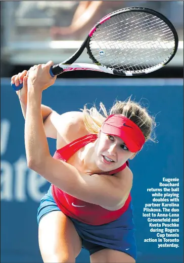  ?? THE CANADIAN PRESS ?? Eugenie Bouchard returns the ball while playing doubles with partner Karolina Pliskova. The duo lost to Anna-Lena Groenefeld and Kveta Peschke during Rogers Cup tennis action in Toronto yesterday.