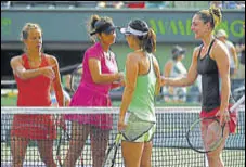  ?? GETTY IMAGES ?? Sania Mirza and Barbora Strycova (left) shake hands with Gabriela Dabrowski (far right) and Yifan Xu after the loss.