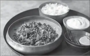  ??  ?? Above: Sri Lankan dal with coconut and lime kale, prepared by Meera Sodha at her home in London.