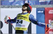  ?? MARCO TROVATI — THE ASSOCIATED PRESS ?? Greece’s Aj Ginnis celebrates taking the silver medal in the men’s World Championsh­ip slalom race on Sunday.