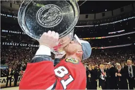  ?? ASSOCIATED PRESS FILE PHOTO ?? In this June 15, 2015, photo, Blackhawks’ Marian Hossa kisses the Stanley Cup after defeating the Tampa Bay Lightning in Game 6 of the final series in Chicago.