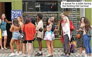  ?? ?? A queue for a toilet during the Notting Hill Carnival