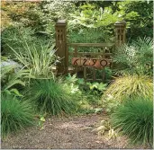 ??  ?? BELOW Fine-textured grasses surround an Arts & Crafts entry marker the homeowner designed using salvaged newel posts.