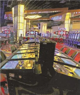  ?? AP FILE PHOTO ?? GAMBLING GREEN: With a week still to go, Plainridge Park Casino has seen a slight increase in gross gambling revenue this fiscal year.