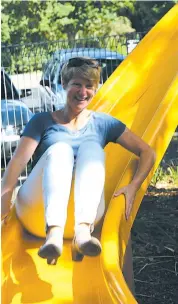  ??  ?? Prue Metcalfe tests the slide on Oak Street kindergart­en’s new treehouse, which she helped design. See the full story on page 33.