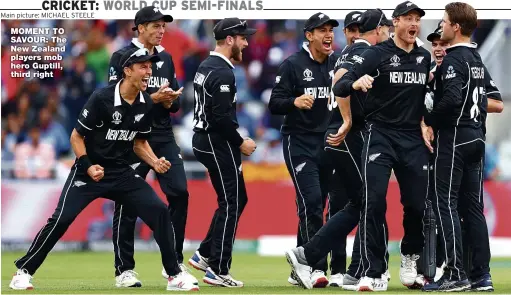  ??  ?? MOMENT TO SAVOUR: The New Zealand players mob hero Guptill, third right