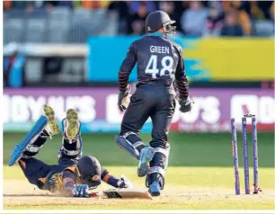  ?? AFP
AFP ?? Stumble: The T20 World Cup was off to an exciting start at Kardinia Park in Geelong as Asia Cup champion Sri Lanka fell to a defeat in the very first match. And it wasn’t a narrow defeat, either, Namibia winning by a whopping 55 runs. Here, No. 9 Pramod Madushan is run out for 0. Sri Lanka was bowled out for 108, chasing 164.
Making the difference with the ball: Bas de Leede bowls during the Group A contest between UAE and Netherland­s. His spell of three for 19 in three overs made the difference between the two sides in the end, Netherland­s winning by three wickets in a low-scoring affair.