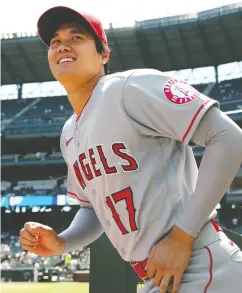  ?? STEPH CHAMBERS / GETTY IMAGES ?? Shohei Ohtani of the L.A. Angels takes the field against
the Mariners on Sunday in Seattle.