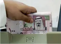  ?? — AFP ?? Speculatio­n that Saudi Arabia might hold off on hiking rates helped to drive the three-month Saudi interbank offered rate as much as 16 basis points below its US dollar equivalent last week.