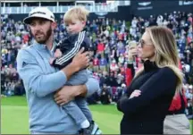  ?? GETTY IMAGES FILE PHOTO ?? Star golfer Dustin Johnson, Paulina Gretzky and their son, Tatum, will not be in South Florida for this week’s Honda Open.