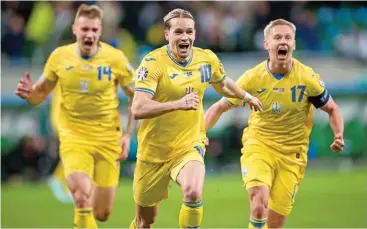  ?? ?? Ukraine’s Mykhailo Mudryk (C) celebrates with teammates after scoring against Iceland on Tuesday