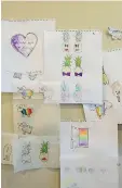  ??  ?? LGBTQ+ friendly cards by Kate Hofstra and
Kate Cowles are pinned on the wall of their Saskatoon residence.