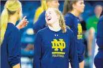  ?? PHOTO PROVIDED BY MIKE MILLER ?? Notre Dame’s Nancy Kane shares a laugh with teammate Monroe Olsen during a 2019 match against Michigan.