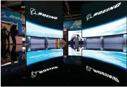  ?? SEONGJOON CHO — BLOOMBERG ?? Boeing logos are displayed at the company’s booth during the Singapore Airshow in Singapore on Feb. 12.