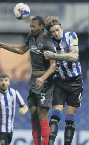  ?? PICTURE: MIKE EGERTON/ PA ?? MY BALL: Brentford’s Ethan Pinnock and Sheffield Wednesday’s Aden Flint compete for the ball during last night’s Championsh­ip match at Hillsborou­gh.