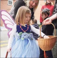  ?? Hearst Connecticu­t Media file photo ?? This winged fairy picks up treats at the Halloween Walk in 2016.