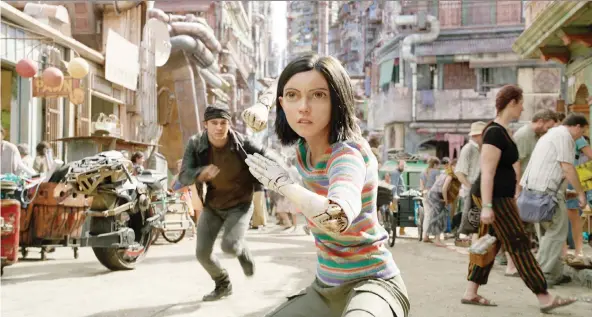  ?? 20TH CENTURY FOX ?? Actors Keean Johnson, left, and Rosa Salazar star in James Cameron’s heavily computeriz­ed Alita: Battle Angel, which is now in theatres.