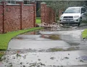  ??  ?? A brick fence is damaged at the housing developmen­t.